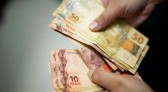 Caixa paga novo Bolsa Família a beneficiários com NIS de final 2